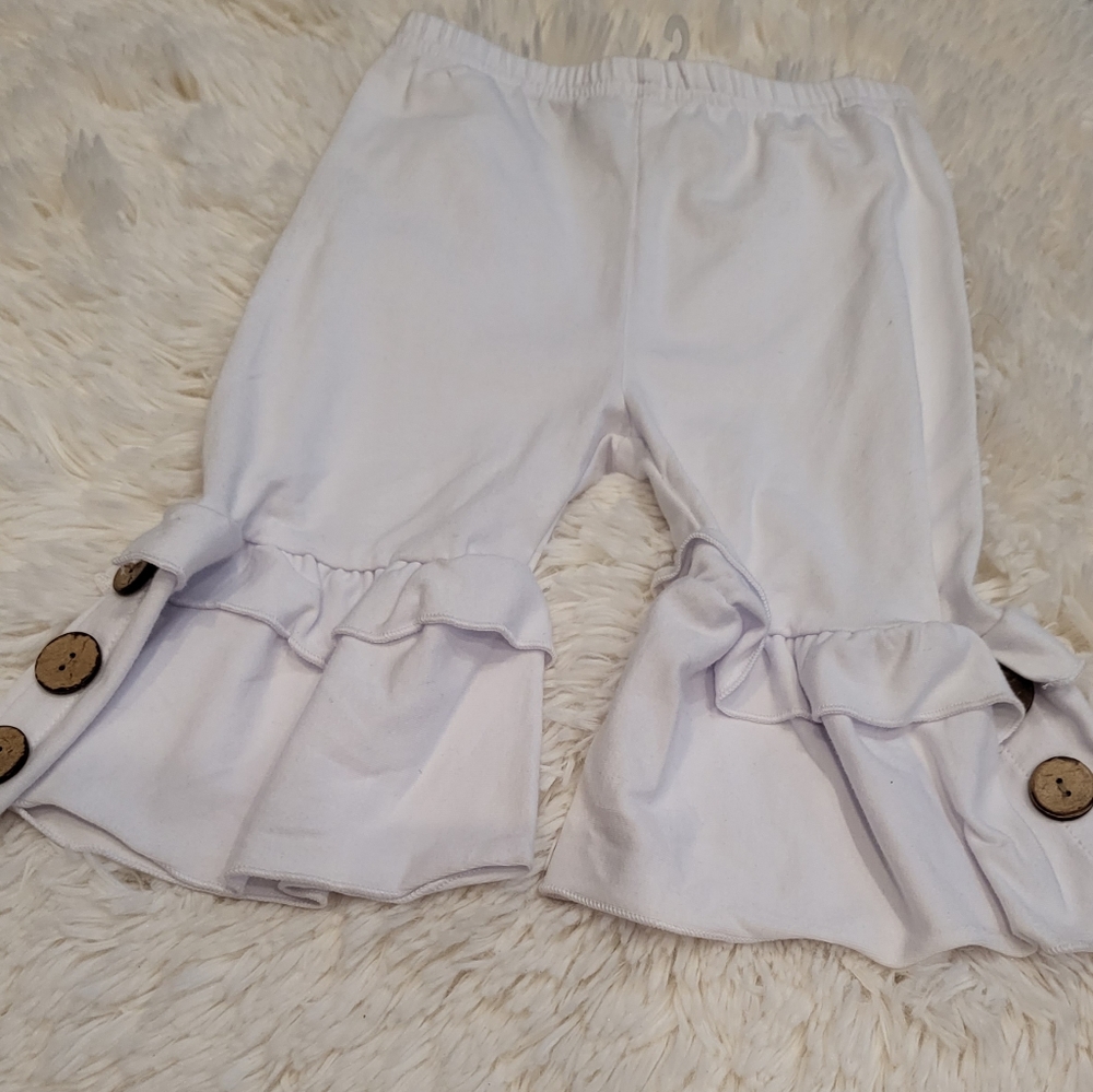 White Stretch Capri with button and ruffle legs